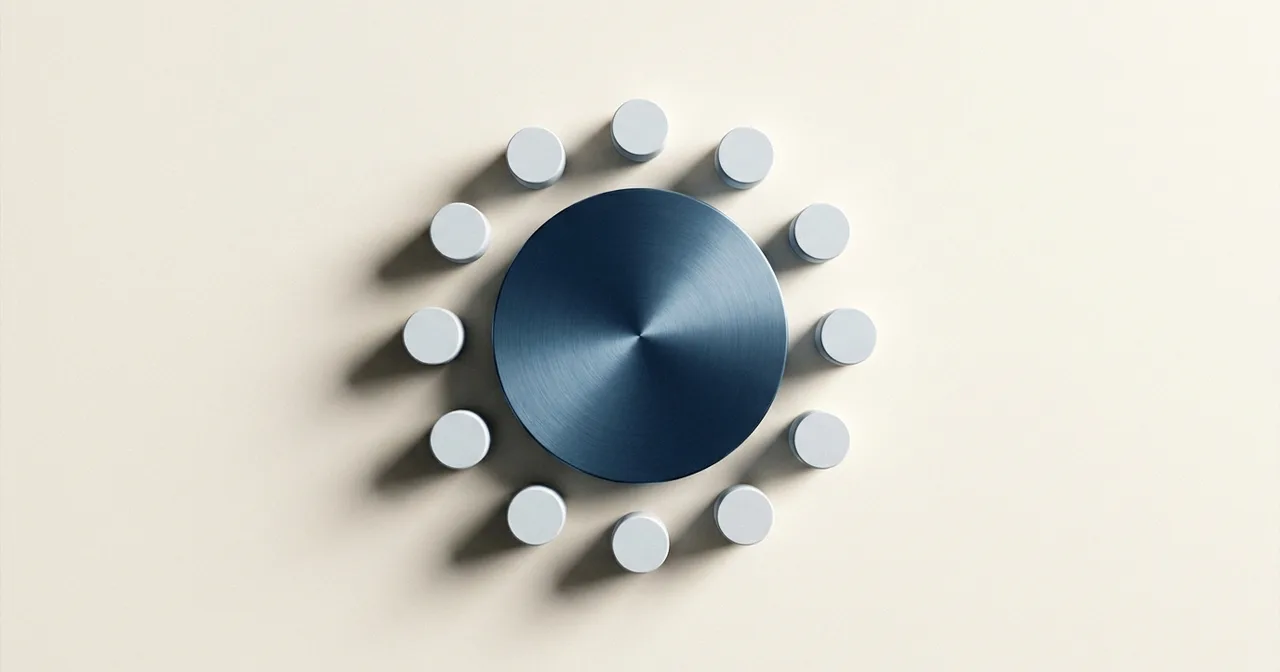 Cercle de petits volumes blancs identiques disposés régulièrement autour d'un disque bleu acier, vu de dessus.